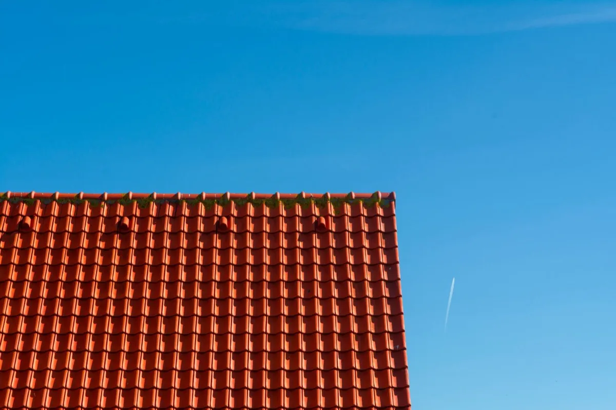 Tile roof gable in full sun, the kind of exposure that sets roof life in St. Cloud, MN